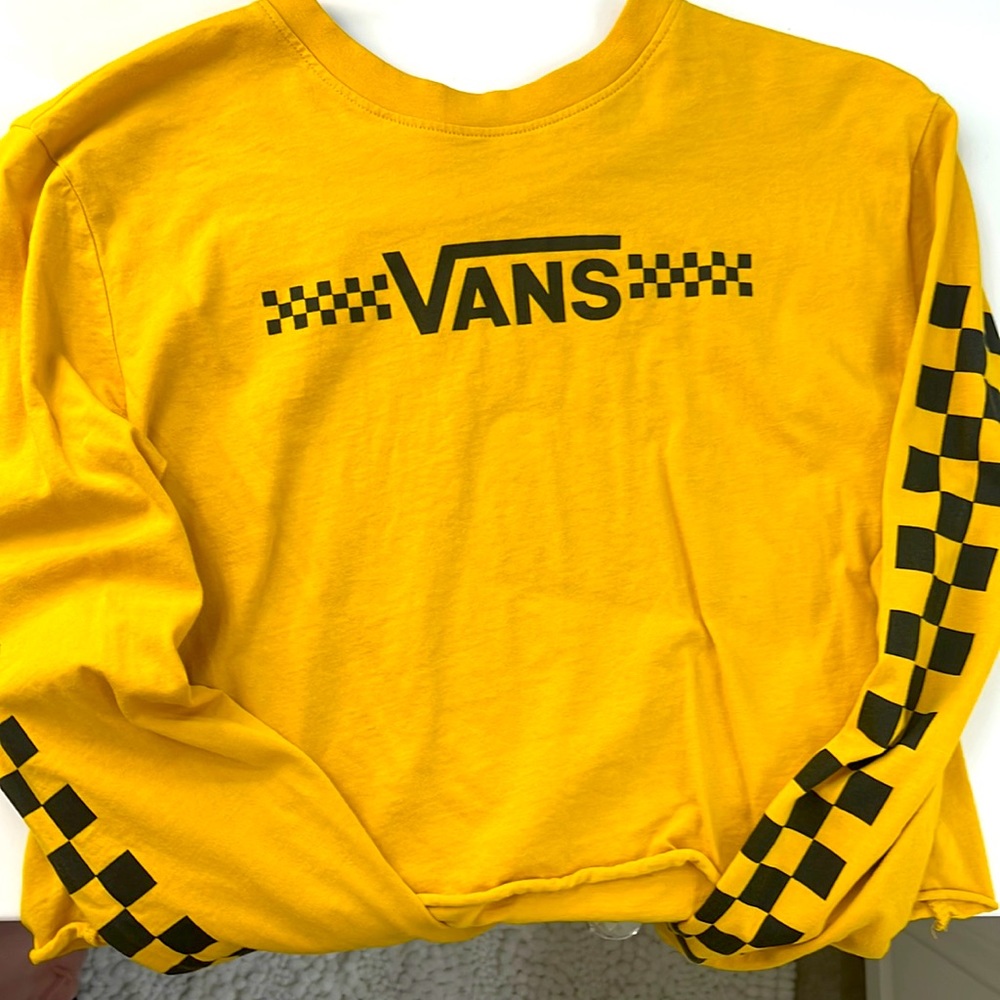 Cropped mustard yellow longsleeve shirt with checkered prints on the sleeves.